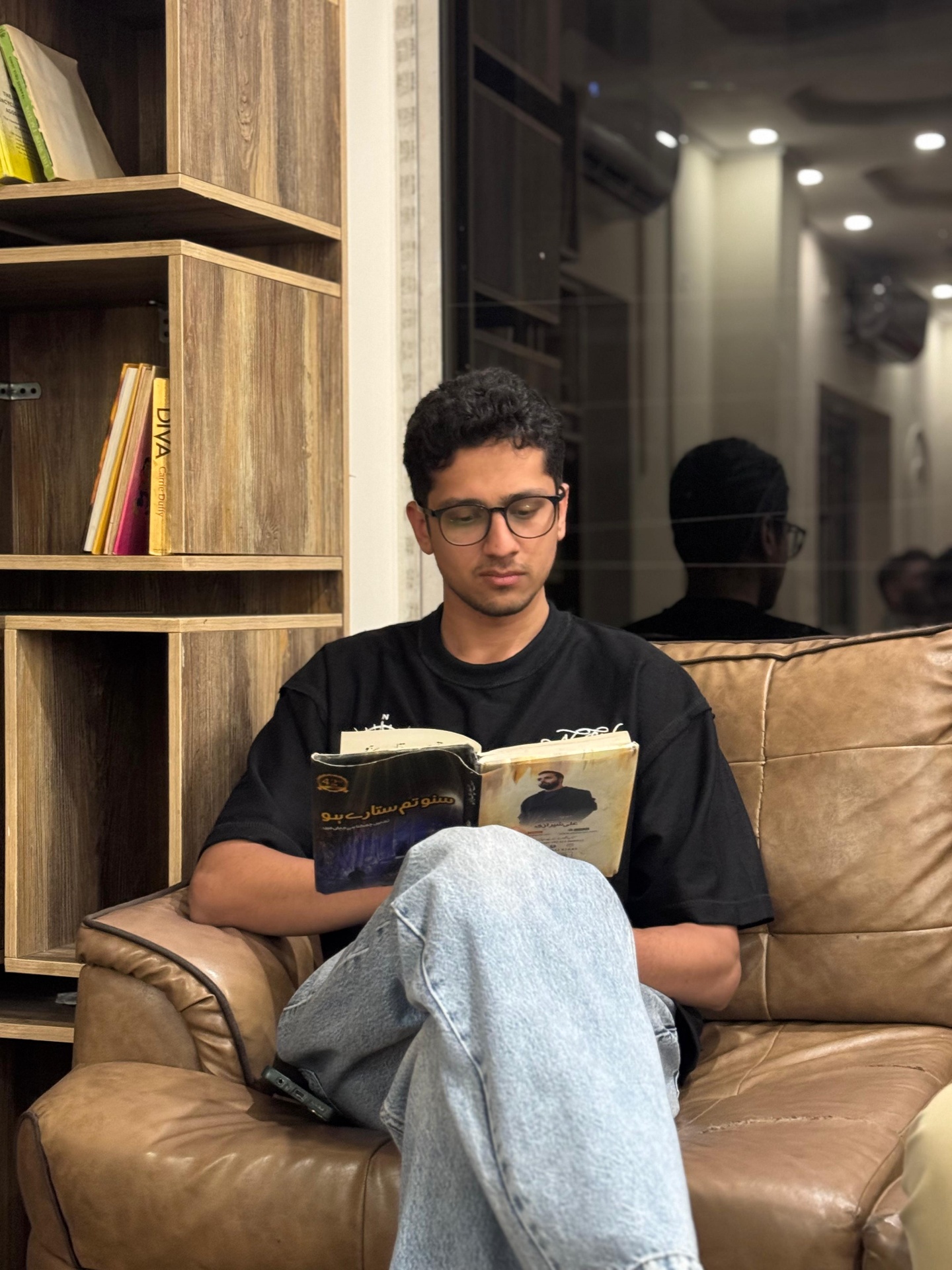Ahmed Raza reading a book